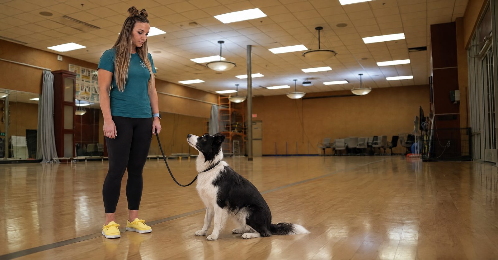 Pet Parent touring the Partners Dogs Cave Creek training facility with a trainer